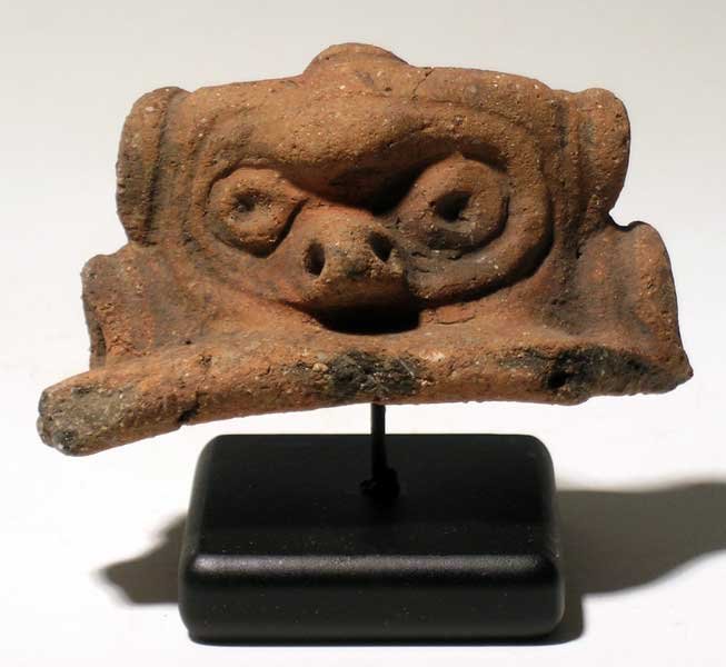 Taino head fragment from Hispaniola: A superb Taino head fragment from Hispaniola, c. 1000 – 1500 AD. It is 3 ½ in (8.9cm) wide and depicts a zoomorphic deity, most likely the Monkey God. Superbly detailed, good mineral deposits, moun
