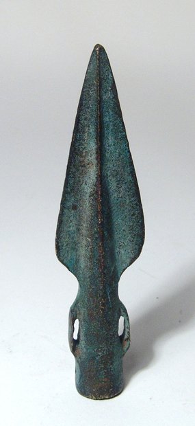 Bronze Age spear head, Western Europe: A nice Bronze Age spear head, Western Europe, c. 1500 - 1000 BC, with triangular blade and tubular socket with two rectangular loops for fastening on either side. L: 4 in (10.1 cm). Intact, nice patin