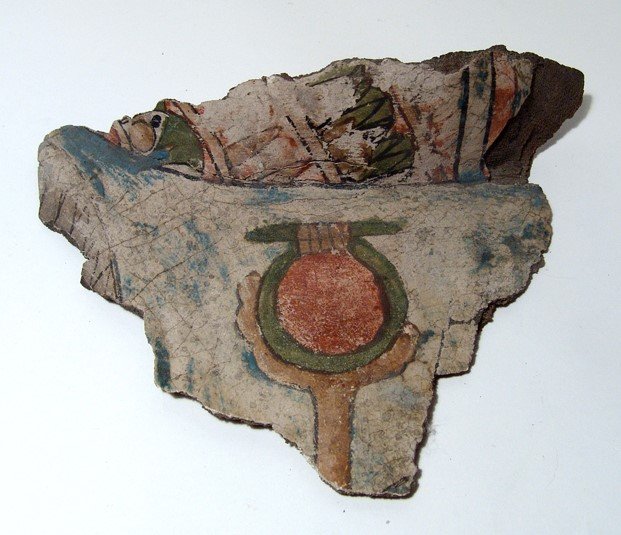 Egyptian painted cartonnage fragment: An Egyptian painted cartonnage fragment, 3rd Intermediate - Late Period, c. 1075 - 343 BC, from the shoulder area with the edge of the feathered headdress and edge of broad collar visible, the foot of