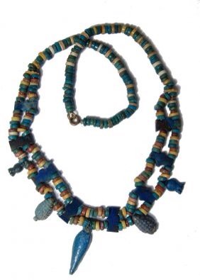 Beautiful Egyptian faience necklace: A beautiful necklace with 18th Dynasty faience beads. The necklace is composed of eight lapis lazuli spacer beads and 5 blue faience molded beads - 2 poppies, 2 grape clusters and one petal. These 18t
