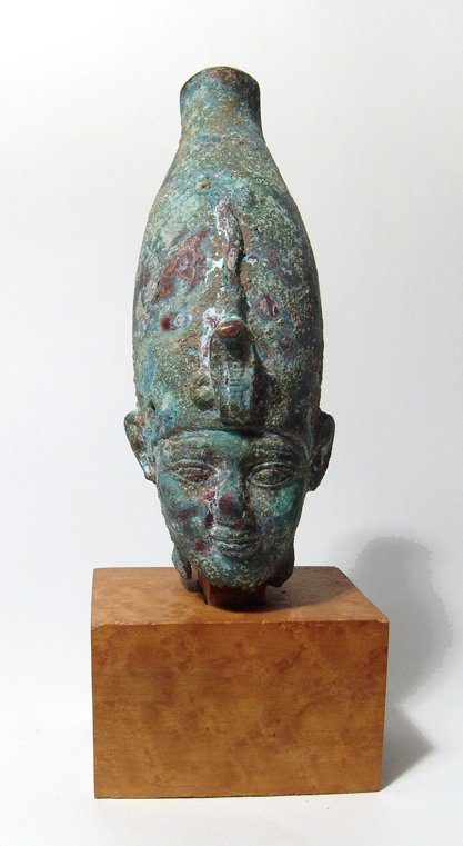 Beautiful Egyptian bronze head of Osiris: A large and beautiful Egyptian bronze head of Osiris, 26th Dynasty, c. 664 - 525 BC, from a statue which originally stood approximately 2 1/2 - 3 feet tall. This Osiris is depicted wearing the white c