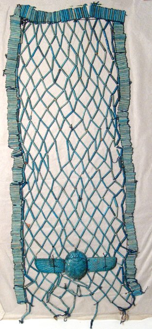 Egyptian beaded pectoral net with winged scarab: A beautiful Egyptian beaded pectoral net with winged scarab, Late Period, c. 664 - 30 BC, which would have been sewn onto the front of the bandages of a mummy. The scarab and all the beads are well pr