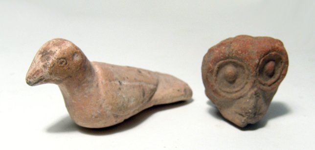Danubian ceramic head and a Syrian bird: A Danubian ceramic head and a Syrian bird. Lot includes a terracotta votive head, c. 300 BC, from the Danube Basin, (1 7/8 in x 1 3/4 in, 4.9 x 4.6 cm); and a terracotta votive in the form of a bird, 