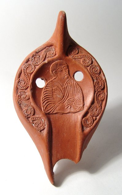 A Roman Red-ware Lamp Fragment with Apostle Peter: A Roman Red-ware Lamp Fragment with Apostle Peter Enthroned, North Africa, c. 5th Century AD. Cf. Lampes antiques d'Algerie II no. C377/78. African red-ware Pottery provides some of the oldest motifs 