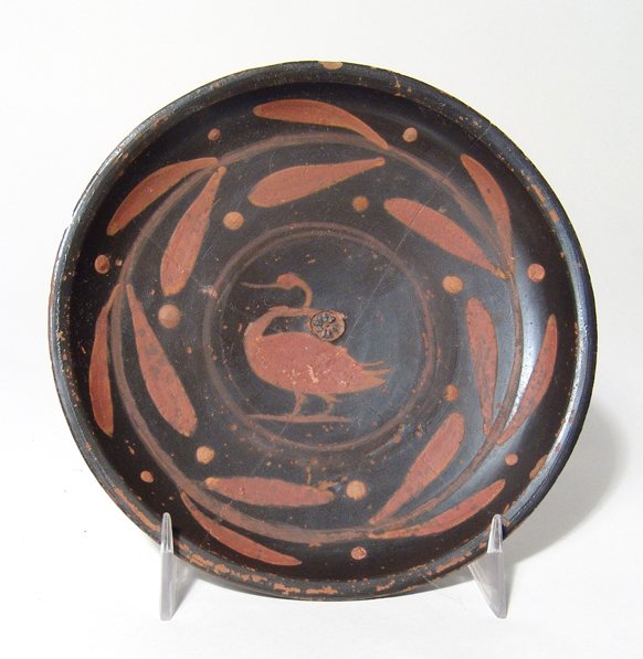 Apulian footed plate with a central swan: A nice Apulian footed plate with a central swan, Magnia Graecia, c. 350 - 330 BC, and a laurel wreath and berry pattern running around the inner wall. Another laurel wreath band runs along the exterio