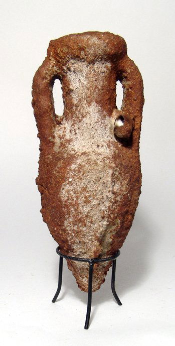 A nice sea-salvaged Roman amphora: A nice sea-salvaged Roman amphora, c. 1st - 3rd Century AD, of characteristic form with tapering body, two lop handles and a thick, rounded rim. H: 7 3/8 in, (18.6 cm). Intact with thick marine and mi