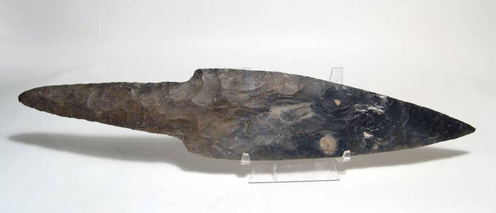 A choice Mayan stone blade, Belize: A choice Mayan stone blade, Belize, c. AD 250 - 600, the blade leaf-shaped with sharp edges, the handle or tang thick and solid. A formidable weapon either attached to a shaft as a spear or wielded by