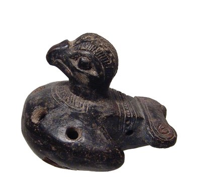 Tairona ocarina in the form of a bird, Colombia: An exquisite Tairona ocarina in the form of a bird, Colombia, c. AD 1000 - 1500, nicely burnished with dark brown slip, the curving breast with four holes, a detailed collar above, The head of the bir