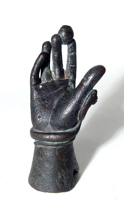A bronze hand from a statue: A bronze hand from a statue, c. 18th - 19th Century, perhaps of the goddess Venus, her fingers extended and holding a small globe, a serpent wrapped around her wrist. Intact and quite solid, holes nea