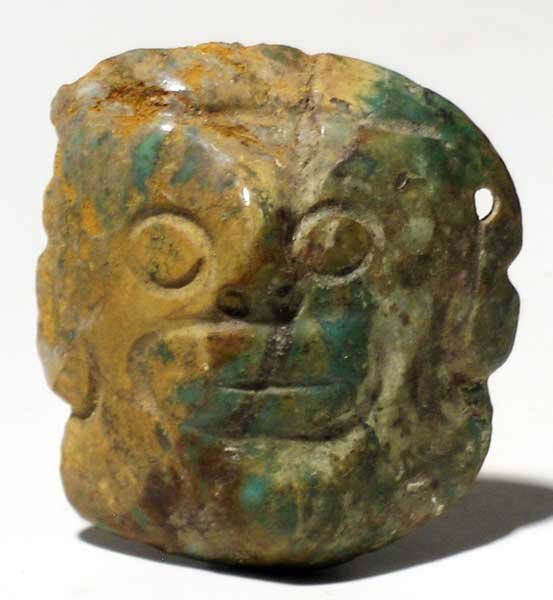 A fine Mixtec jade pendant from Mexico: A fine Mixtec jade pendant from Mexico, c. 1000 – 1500 AD. It is 2-1/8 in high and depicts a monkey deity. The face is expressive, the stone is beautifully striated and highly polished. Ex Walley co