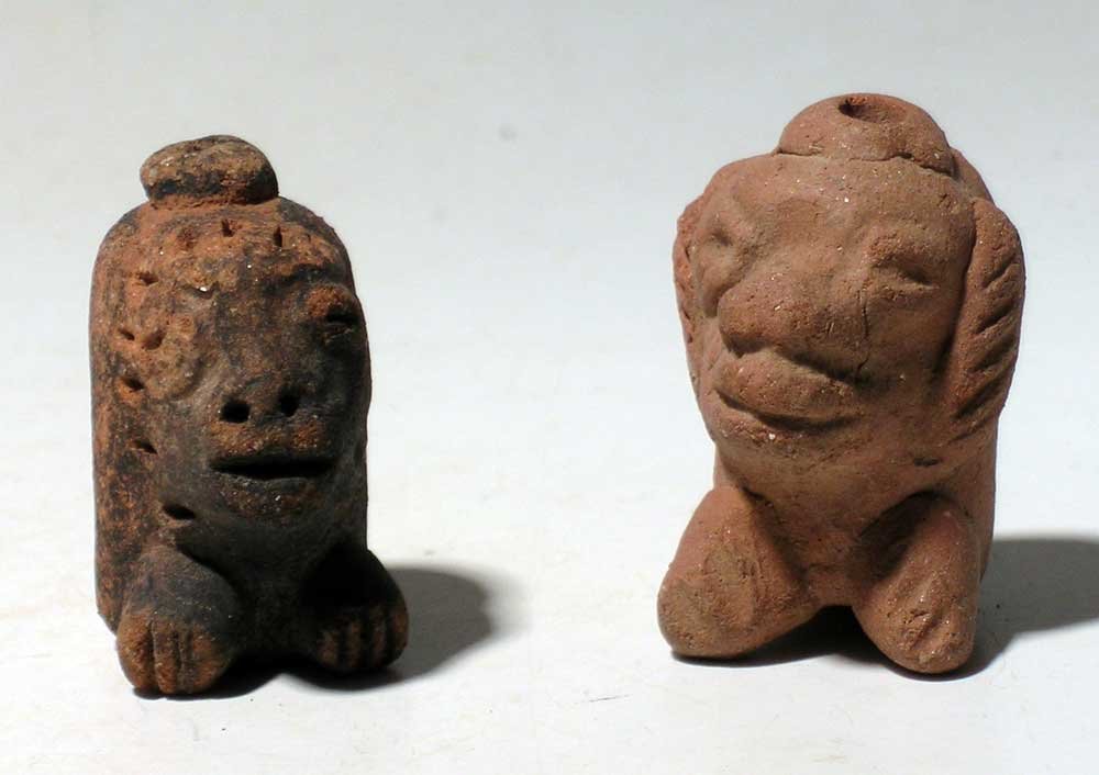 Pair of Vera Cruz deity whistles from Mexico: A pair of Vera Cruz deity whistles from Mexico, c. 300 – 900 AD. They are 1-5/8 in high and depict stylized feline deities. One with extensive chapopote and both with great tone. Ex C.W. Slagl