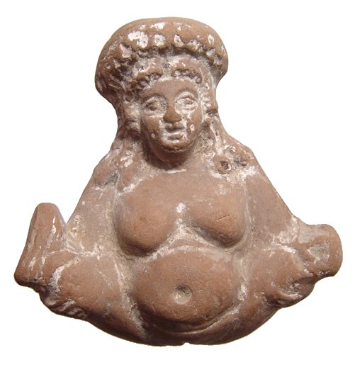 Egyptian ceramic fecundity figure: An Egyptian ceramic fecundity figure, Ptolemaic, 3rd - 2nd Century BC, in the form of a naked female, her hands around each ankle with legs raised to expose her genitals. She wears a large wreathed he
