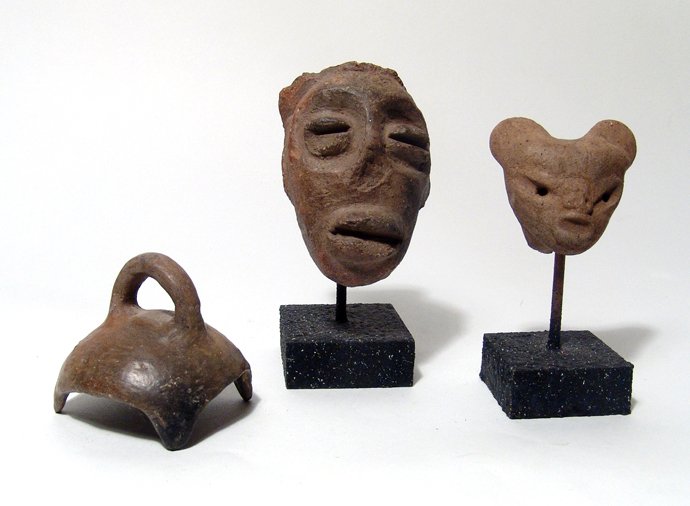 A lot of 3 Pre-Columbian ceramic objects: A lot of 3 Pre-Columbian ceramic objects. Lot includes a pair of Pre-Classic pieces from Mexico, c. 500 BC - AD 250, one a small ceramic head of an animal, (H: 2 in, 5 cm); and the other an oval head 