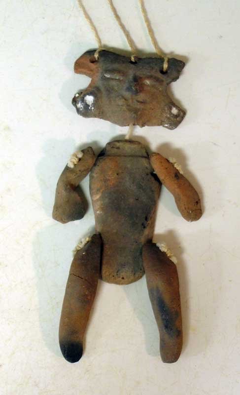 A rare Teotihuacan articulated puppet: A rare Teotihuacan articulated puppet, ca. 400 – 650 AD. This fine Xolalpan type is 4-1/2 in long and has been reassembled with modern string for suspended display. Stucco remnants, good mineral dep
