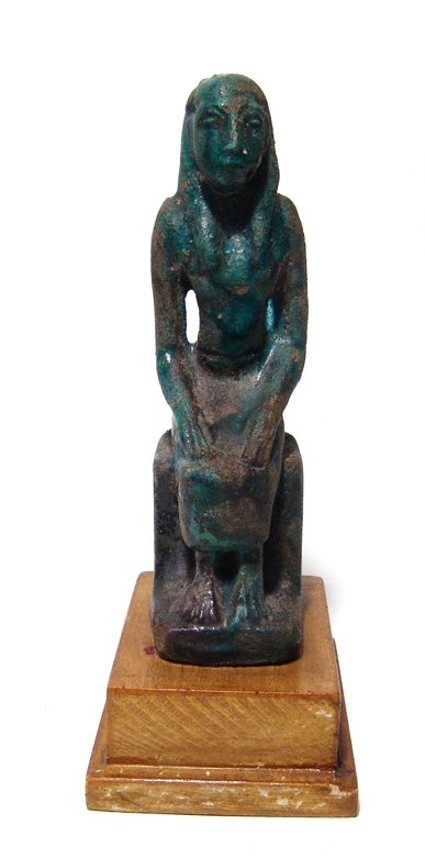 Egyptian glazed composition figure of seated Pharaoh: An Egyptian glazed composition figure of seated Pharaoh, Graeco-Roman, c. 2nd Century BC - 2nd Century AD, on low throne, wearing tripartite headdress and long kilt, his hand resting on his lap. The f