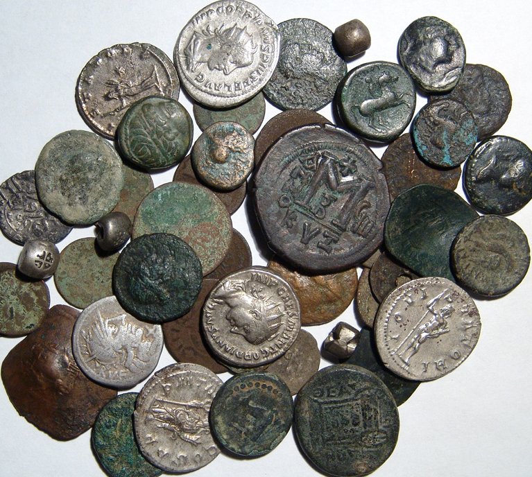A lot of 48 mixed ancient and medieval coins: A lot of 48 mixed ancient & medieval coins. Lot includes a Greek bronze coin of Philip II of Macedon, some Roman bronze and silver coins including a Roman Republican denarius, Byzantine bronze coins, 
