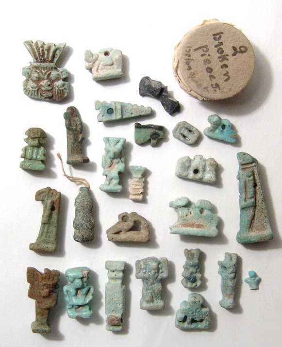 A lot of 25 mixed Egyptian faience amulets: A lot of 25 mixed Egyptian faience amulets, Late Period, c. 664 - 30 BC, and include and array of types representing many different deities, a few with minor chipping and/or losses. Also included and