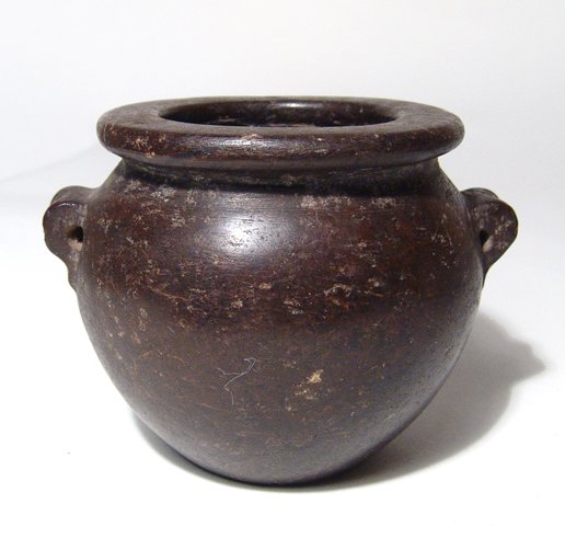 A fantastic Egyptian carved stone vessel: A fantastic Egyptian carved stone vessel, Early Dynastic Period, c. 3100 - 2600 BC, beautifully carved with excellent polished, the lug handles neatly formed, the rim wide and flat and the interior we