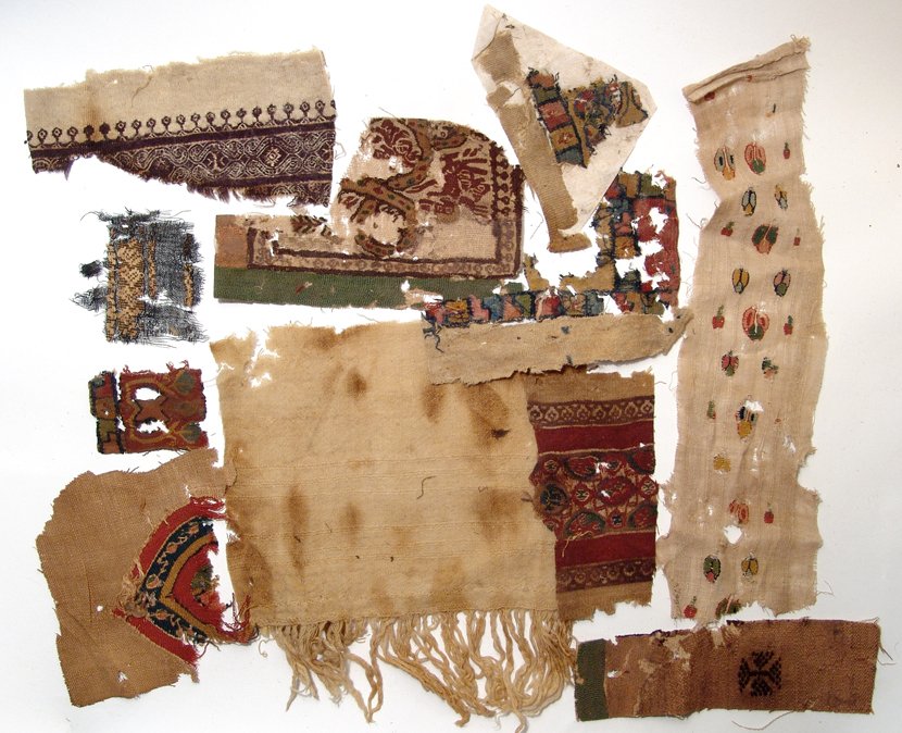 A lot of 10 Coptic textile fragments: A lot of 10 Coptic textile fragments, c. 4th - 7th Century AD, with various patterns, many with vibrant color, represented. Largest L: 7 3/5 in (19.3cm), H: 3 ¾ in (9.5cm). Ex estate of a former rest