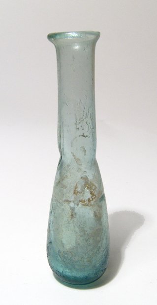 A Roman pale blue unguentarium: A Roman pale blue unguentarium, c. 1st - 2nd Century AD, the body is pear-shaped with tubular neck and lightly flared mouth with rim ground flat. A nice little bottle with light iridescence and in a g