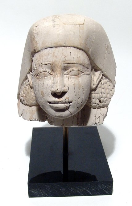 19th Century Egyptian-style carved limestone head of a: A beautiful 19th Century Egyptian carved limestone head of a pharaoh, in ancient style with exquisite detail and mounted on a custom base. 5 ½ in x 5 ½ in (13.9 x 13.9 cm).