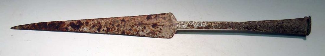 An exceptional Kushan spear, c. 1st– 4th century AD: An exceptional Kushan spear, c. 1st– 4th century AD. This impressive weapon is 20 in long and is made from iron. It retains a remnant of the original wood shaft. Solid, with strong encrustation.