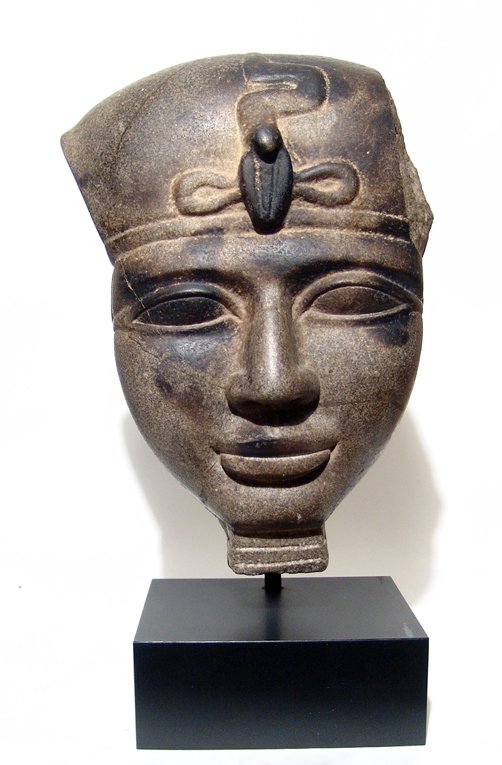 Phoenician/Egyptian facial portion from a sarcophagus: A large Phoenician/Egyptian stone facial portion from a sarcophagus, Late Period, c. 664 - 332 BC, with handsome features, extremely well-rendered with large almond-shaped eyes, wide nose and pursed l