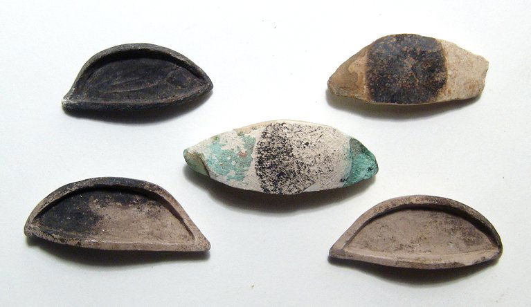 A lot of 5 Egyptian stone eye inlays for statuary: A lot of 5 Egyptian stone eye inlays for statuary, Late Period, c. 664 - 30 BC, four of limestone with added pigment, the other in alabaster with traces of the bronze frame it originally sat in. Large