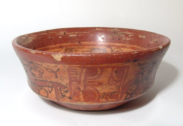 A nice Mayan polychrome bowl: A nice Mayan polychrome bowl, c. AD 400 - 600, from the lowlands of Guatemala. This intact vessel depicts a pair of priests separated by stylized glyphs on its outside. The inside is decorated with a 