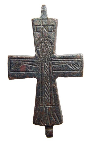 Half of a Byzantine bronze Enkolpia: Half of a Byzantine bronze Enkolpia depicting the Christ, c. 10th - 12th Century AD, arms spread and an inscribed cross above his head. Intact and incised with nice detail. H: 2 5/16 in (5.9 cm). Ex R