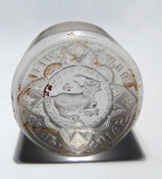 A nicely carved Central Asian glass seal: A nicely carved Central Asian glass seal, 19th Century, carved in the style of the Indus Valley Civilization with a geometric motif around a central horned bull. 2.4 x 1.8 cm. Ex J. L. Malter collecti