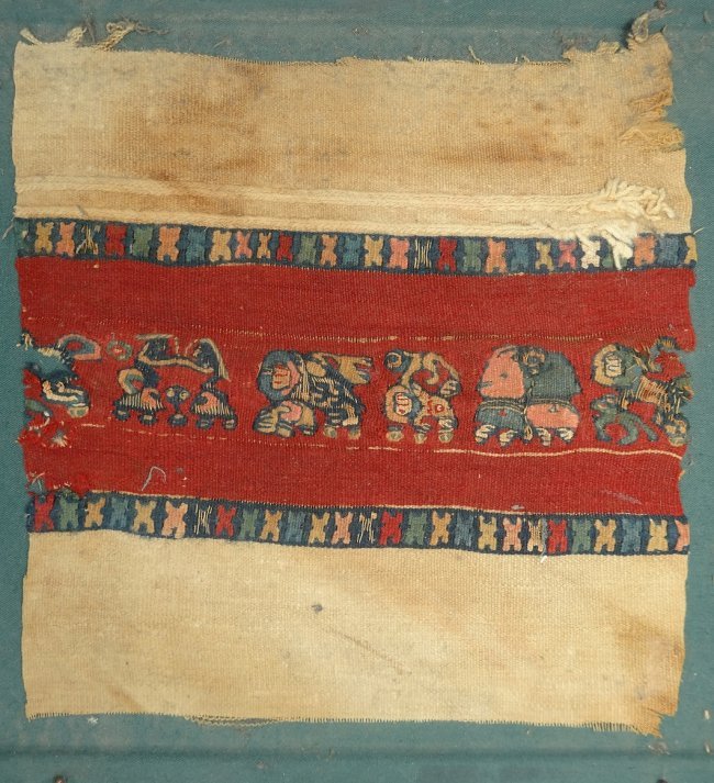 A very attractive and colorful Egyptian Coptic textile: A very attractive and colorful Egyptian Coptic textile, c. 9th Century AD, depicting dancing, stylized flora and fauna. A unique textile mounted on a wooden board covered in a green cloth, L: 9 7/8 in