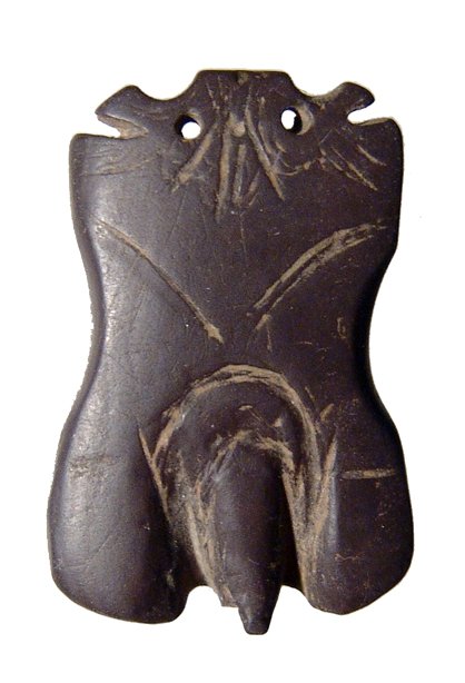 Roman Egyptian stone amulet of a male torso: A choice Roman Egyptian stone amulet of a male torso, c. 1st - 2nd Century AD, limbless with the genitalia well-defined, two suspension holes at top. 1 1/2 in x 1 in (3.8 x 2.5 cm). Intact and a very 