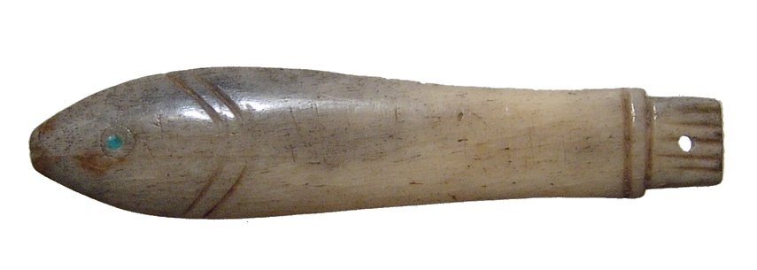 Egyptian inlaid bone amulet of a fish: An Egyptian inlaid bone amulet of a fish, 3rd - 5th Century AD, with green paste eyes and incised detail, suspension hole through tail. L: 5 cm. Intact with wear from being worn in antiquity. Ex San D