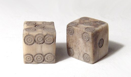 A nice pair of Roman bone dice: A nice pair of Roman bone dice, c. 1st - 4th Century AD, both matching and very well executed with crisply carved numbers. Sides averages 9mm in width. Ex Los Angeles private collection.