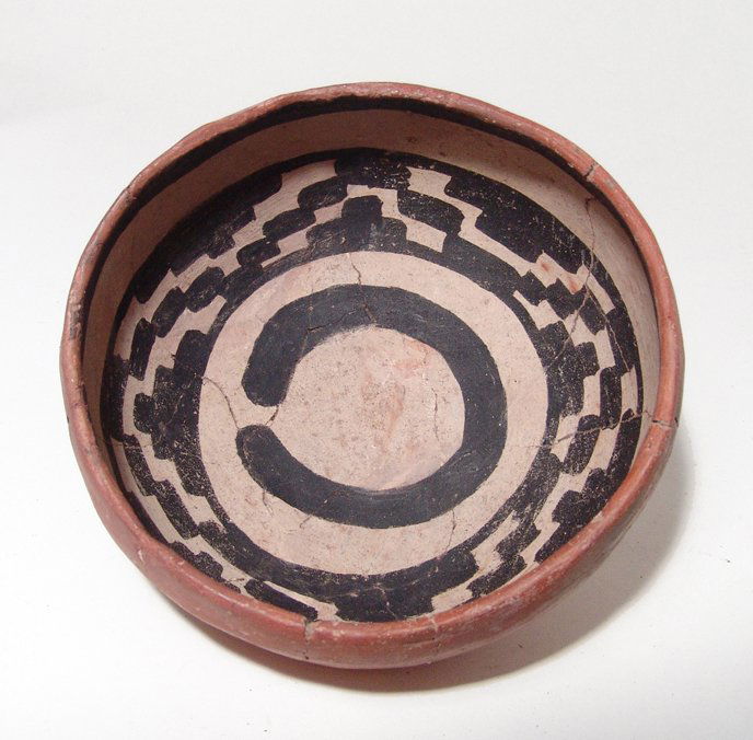 Anasazi Salado Polychrome transitional Gila Pinto bowl: An Anasazi Salado Polychrome transitional Gila Pinto bowl, American Southwest, c. AD 1300 - 1400, the interior decorated with a pair of bands, one containing geometric motifs, in dark brown slip again