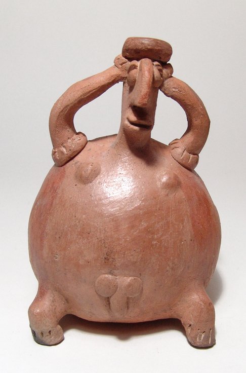 A Jalisco sitting nude male figure: A Jalisco sitting nude male figure, West Mexico, c. 200 BC - AD 200, the body round with short legs, the head nicely detailed with exaggerated features and low headdress, hands on his head, and showin