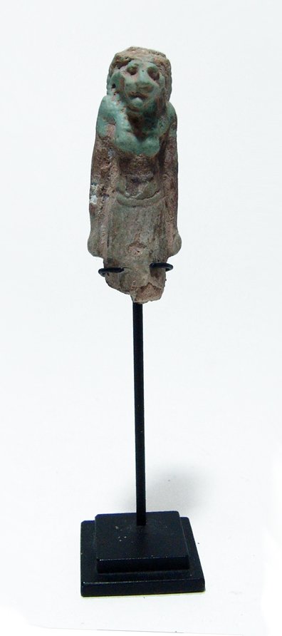 Egyptian pale blue faience amulet of Mayhes: An Egyptian pale blue faience amulet of Mayhes, Late Period, c. 664 - 30 BC, with attractive leonine features and wearing a long kilt. A scarcer deity in an amulet and nicely mounted on a custom base.