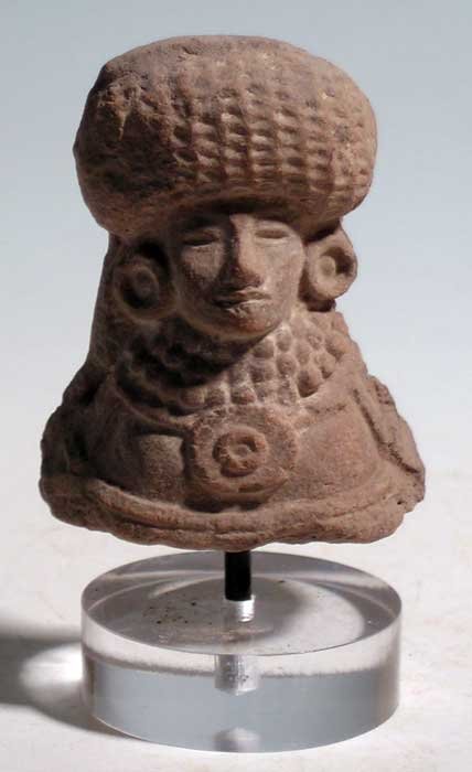 An exceptional Teotihuacan bust from Mexico: An exceptional Teotihuacan bust from Mexico, ca. 650 - 750 AD. This superbly detailed Metepec example is 2-1/4 in high and depicts an enthroned figure wearing a fancy headdress, large ear spools and s