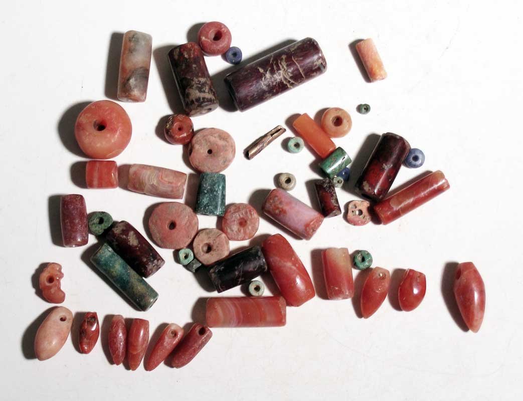 Excellent group of Tairona beads from Colombia: An excellent group of Tairona beads from Colombia, ca. 1000 - 1500 AD. Most are highly polished carnelian examples, including several rare 'bullet' beads. There are also crisocola and even a few small