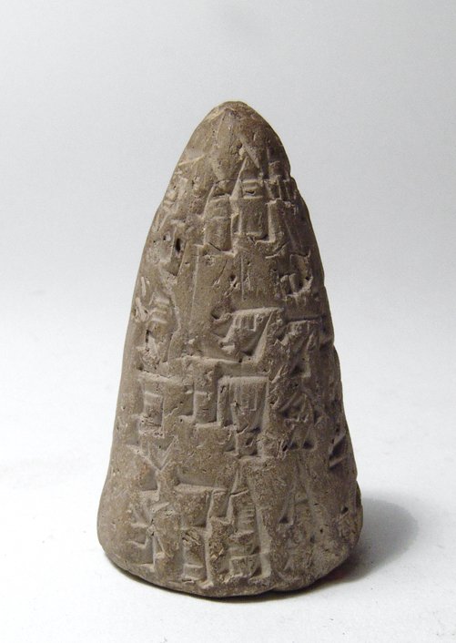 A small Old Babylonian votive cone: A small Old Babylonian votive cone, c. 1900 - 1700 BC, the entire surface covered with neatly incised Cuneiform text. H: 2 in (5.2cm). Light deposits. Ex collection of Addis Finney, a chemical enginee