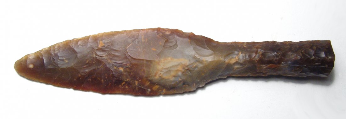 A nice flaked orange-brown jasper knife: A nice flaked orange-brown jasper knife. A lovely example expertly knapped in the manner of the ancient originals with sharp edges and a well-formed handle with central ridges on either side for grip.