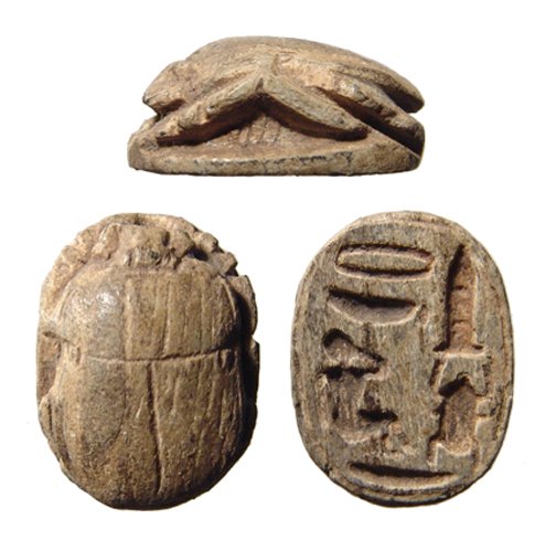 A nice Egyptian brown steatite scarab: A nice Egyptian brown steatite scarab, New Kingdom, c. 1570 - 1075 BC, the body neatly carved with detailed head and legs, the base with well incised hieroglyphic inscription. L: 1.9 x 1.3 cm. Ex Wilt