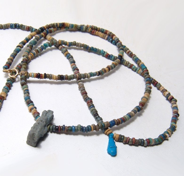 Pair of Egyptian faience bead necklaces with pendants: A pair of Egyptian faience bead necklaces with pendants, Late Period, c. 664 - 30 BC, each with high quality multicolored disk beads; both pendants are intact, one in blue-green faience of the goddess