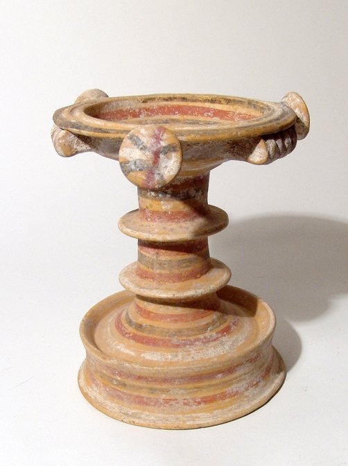 Daunian thymiaterion or Incense Burner, Italic: A painted Daunian thymiaterion or Incense Burner, Italic, c. 5th - 4th Century BC, the tall pedestal base with wide flanges and decorated with alternating bands of red, dark brown and white slip, the 