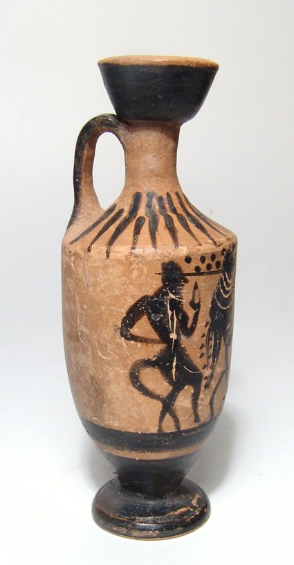 An Attic black-figure lekythos depicting satyrs: An Attic black-figure lekythos depicting satyrs, 5th Century BC, a seated figure, perhaps participating in a Dionysian ritual, between them, two rows of pellets above and rays around the shoulder. H: