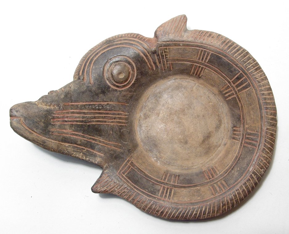 A beautiful Tairona bowl in the form of a fish: A beautiful Tairona bowl in the form of a fish, Colombia, c. AD 1100 - 1350, the shallow bowl with widely flared walls and rim curved outward, the features of the fish extending outward from one side.
