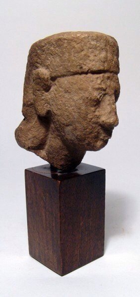 Cyprus limestone head of a man: A limestone head of a man, Cyprus, c. 8th - 7th Century BC, wearing a head cloth. Some weathering and perhaps not finished. Old collection number on back. Age deposits throughout. H: 3 3/8 in (8.5 cm)