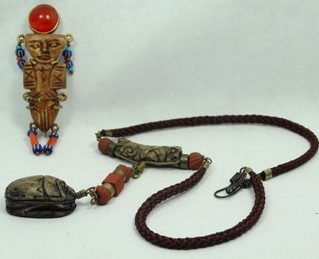 Egyptian Coptic bone doll and Egyptian-style scarab: An Egyptian Coptic bone doll and Egyptian-style scarab. The Coptic bone doll, Roman Egypt, c. 5th-7th Century AD, with a nice desert varnish and in modern times was turned into a pin on a gold setting