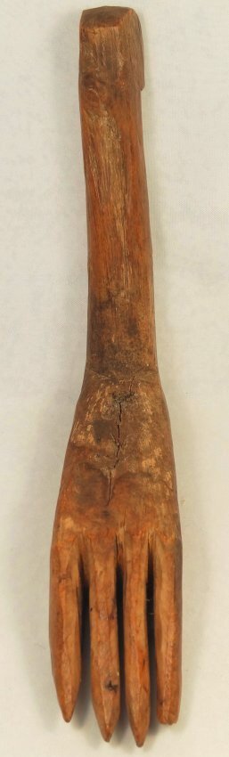 An Egyptian wooden weaving beater: An Egyptian wooden weaving beater, 2nd Intermediate-Ptolemaic Period, c. 1650-30 BC, in the form of a foot with four toes, H: 5 7/8 in (15cm), L: 5 1/3 in (13.5cm). A beater like this would have been 